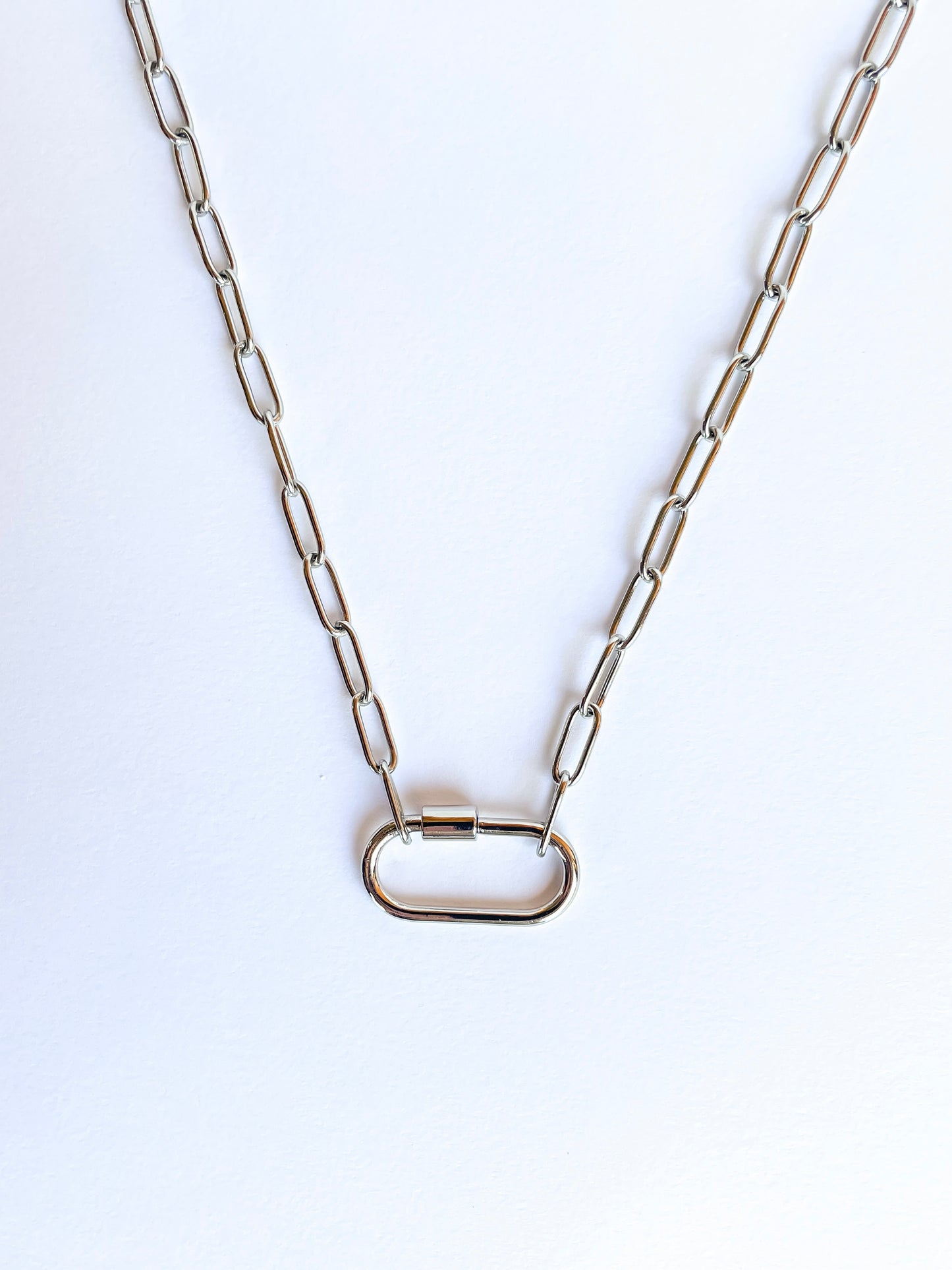 Durable stainless steel carabiner paperclip necklace, available in 18” or 20” lengths, with a secure lobster clasp.